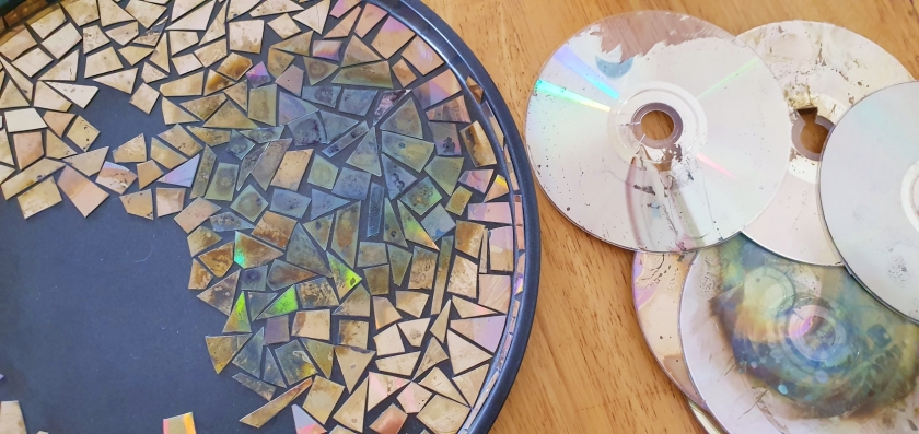 Using old CDs to make a mosaic on a plain tray