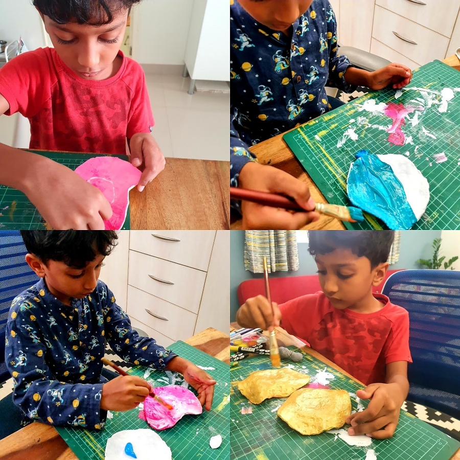 Kid crafting and painting a trinket tray to gift to his teachers on the last day of school